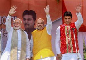 EDS PLS TAKE NOTE OF THIS PTI PICK OF THE DAY::::::::: Agartala: Prime Minister Narendra Modi with Bharatiya Janata Party (BJP) National President Amit Shah, new Tripura Chief Minister Biplab Kumar Deb during the swearing-in ceremony of the newly elected ministers , in Agartala on Friday. PTI Photo(PTI3_9_2018_000129B)(PTI3_9_2018_000205B)