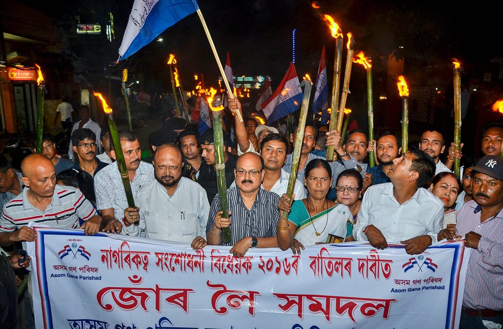 Guwahati: Activists of Asom Gana Parishad (AGP) led by former Assam chief minister Prafulla Kumar Mahanta take out a torch light rally objecting to Citizenship (Amendment) Bill, 2016 in Guwahati on Friday. PTI Photo (PTI5_11_2018_000210B)