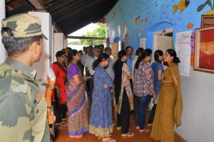 Mangaluru: Voters stand in a queue to cast their votes for Karnataka Assembly election 2018 at a polling station in Mangaluru on Saturday. (PTI Photo)(PTI5_12_2018_000026B)