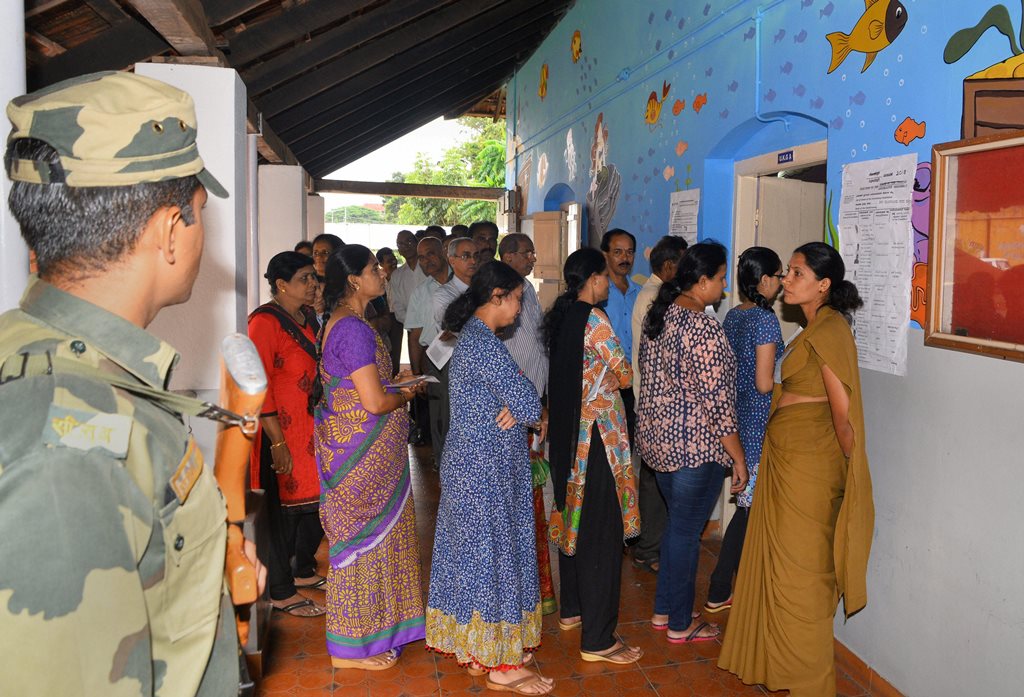 Mangaluru: Voters stand in a queue to cast their votes for Karnataka Assembly election 2018 at a polling station in Mangaluru on Saturday. (PTI Photo)(PTI5_12_2018_000026B)