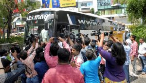 Hyderabad: Media surrounds the bus as Karnataka Congress and JD(S) MLAs arrive at Taj Krishna Hotel, in Hyderabad, on Friday. (PTI Photo) (PTI5_18_2018_000183B)