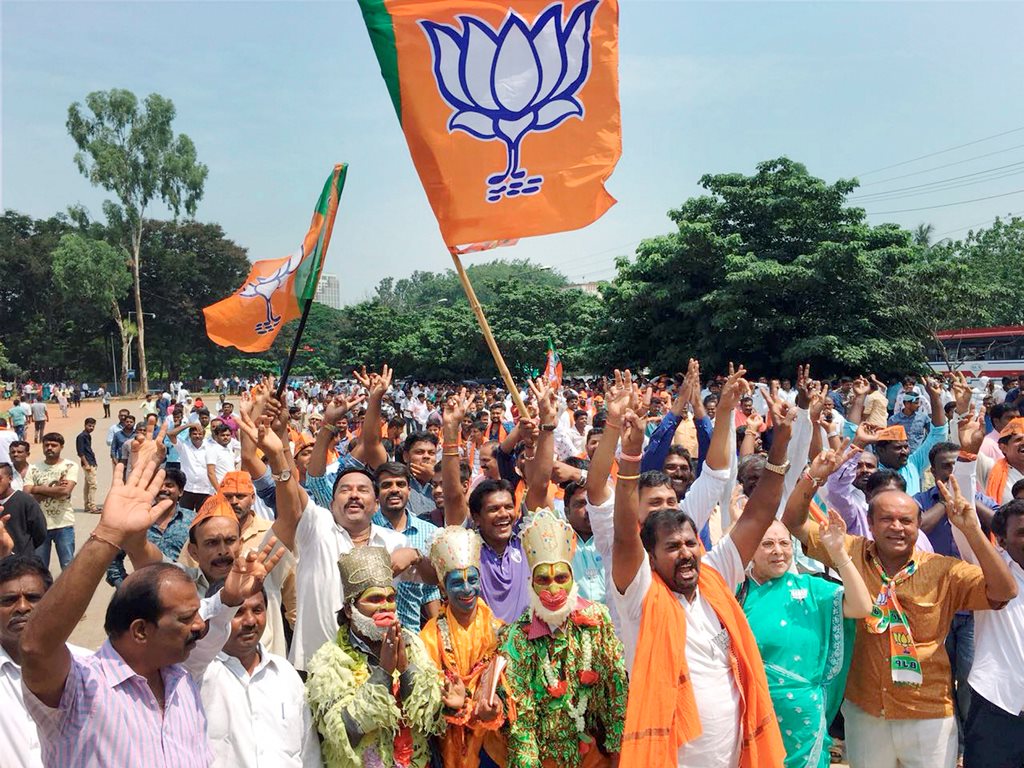 Bengaluru: BJP workers celebrate the party's lead in over hundred Assembly constituencies, as the counting of votes is in progress, in Bengaluru on Tuesday. (PTI Photo / Shailendra Bhojak) (PTI5_15_2018_000019B)