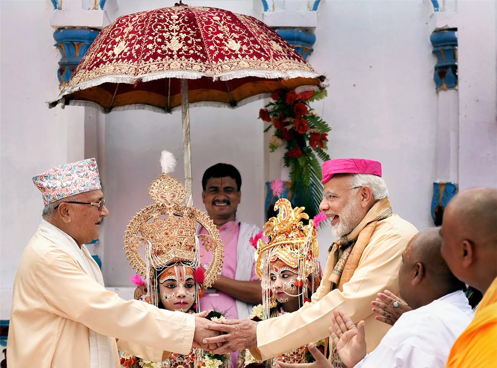 Janakpur: Prime Minister Narendra Modi shakes hands with Nepal Prime Minister Khadga Prasad Oli, during his visit, at 20th century Janaki temple in Janakpur, Nepal on Friday. (PTI Photo / PIB)(PTI5_11_2018_000060B)
