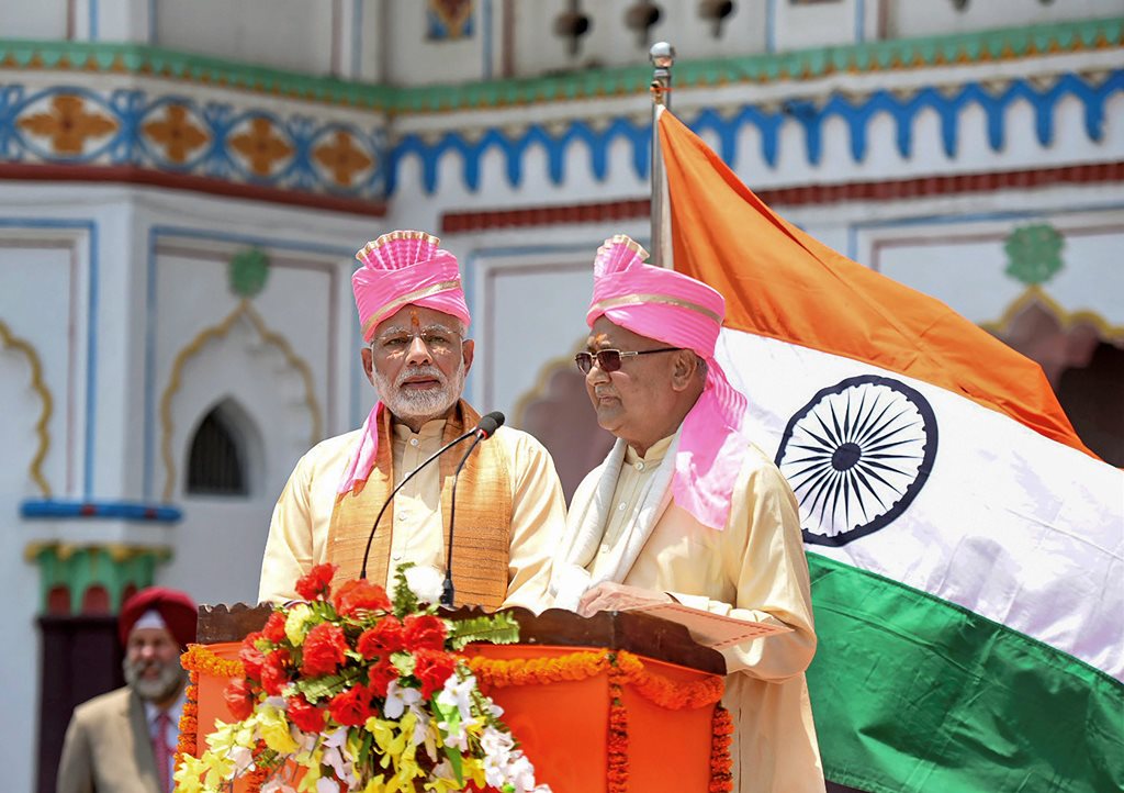 Janakpur: Prime Minister Narendra Modi with Nepal Prime Minister Khadga Prasad Oli, during the inauguration of Janakpur-Ayodhya direct bus service, in Janakpur, Nepal on Friday. (PTI Photo / PIB)(PTI5_11_2018_000063B)