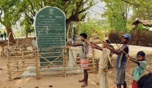 Khunti: Tribals hold bows and arrows near a Patthalgarhi spot at Maoist-affected village Siladon under Khunti district of Jharkhand on Tuesday. The Patthalgarhi movement says that the “gram sabha” has more weight than either the Lok Sabha or the Vidhan Sabha in scheduled areas. PTI Photo (PTI5_1_2018_000146B)