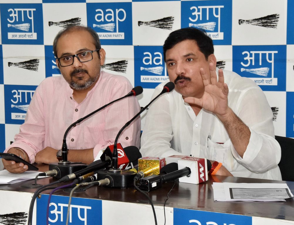 New Delhi: AAP leaders Sanjay Singh and Dilip Pande address a press conference on four years of BJP's government at the Centre, in New Delhi on Saturday. PTI Photo (PTI5_26_2018_000065B)