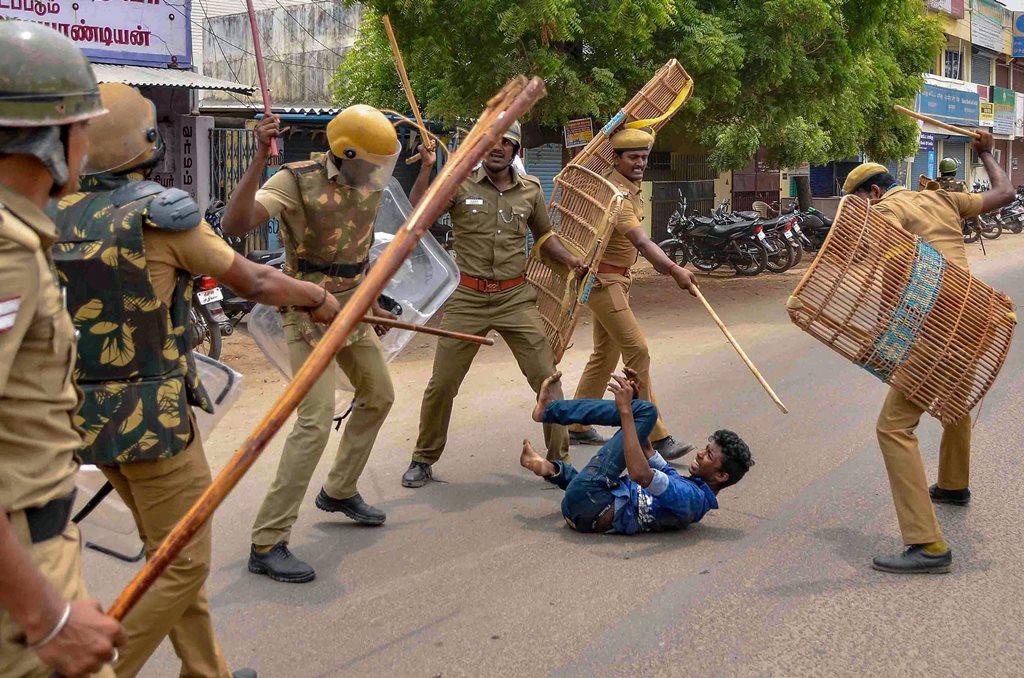 Tuticorin: Police personnel baton charge at a protestor demanding the closure of Vedanta's Sterlite Copper unit, in Tuticorin, on Wednesday. In fresh violence today, one person was killed during the clash, after police's open fire killing at least ten people yesterday, and injuring many others. (PTI Photo) (PTI5_23_2018_000193B)