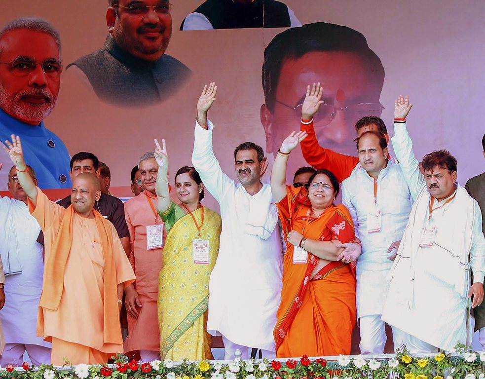 Shamli: Uttar Pradesh Chief Minister Yogi Adityanath with BJP’s Kairana candidate Mriganka Singh and other party leaders during a rally ahead of Kairana Assembly by-polls, in Shamli on Thursday. (PTI Photo) (PTI5_24_2018_000214B)