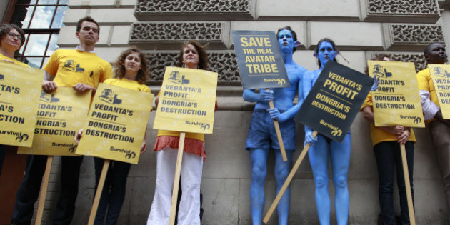 Demonstrators, including a pair dressed as characters from the film Avatar, protest against British mining company Vedanta Resources during their Annual General Meeting in London July 28, 2010. India-focused Vedanta Resources faced protests at its shareholders' meeting on Wednesday from investors and pressure groups over its plans to build a bauxite mine in India's eastern Orissa state, in an area sacred to indigenous people. REUTERS/Stefan Wermuth (BRITAIN - Tags: POLITICS ENERGY SOCIETY BUSINESS)