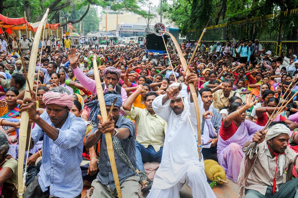 Ranchi: Tribals from various organizations hold bow and arrow during a protest against the state government Chotanagpur Tenancy (CNT) and Santal Pargana Tenancy (SPT) act, in front of the Governor's house, in Ranchi on Friday, June 08, 2018. (PTI Photo)(PTI6_8_2018_000052B)