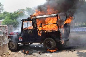 Allahabad: A police jeep in flames after it was torched by the Allahabad Central University students, who were protesting against the 'hostel washout' decision of the administration, in Allahabad on Tuesday, June 05, 2018. (PTI Photo) (PTI6_5_2018_000052B)