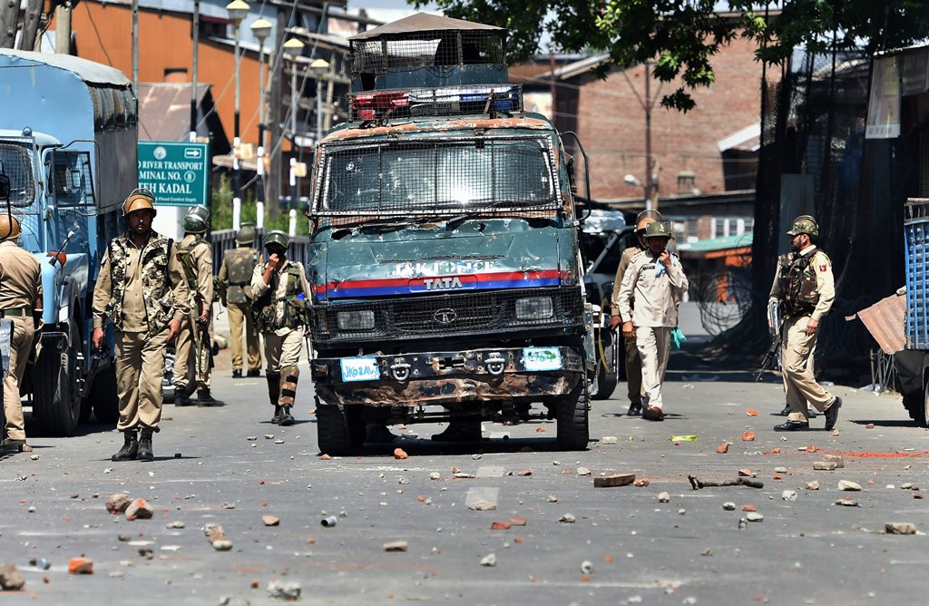 Srinagar: Police personnel during a clash with the protesters, in Srinagar on Saturday, Jun 02, 2018. Clashes erupted after police stopped the funeral procession of the youth Qaiser Amin Bhat who was killed after being hit and run over by a paramilitary vehicle yesterday. (PTI Photo/ S Irfan) (PTI6_2_2018_000100B)