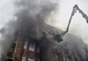 Mumbai: Firefighters try to douse a fire which broke out at Scindia house building, in South Mumbai on Friday, June 1, 2018. The blaze started on the third floor of the I-T office located in multi-storeyed Scindia House. (PTI Photo/Shashank Parade) (Story no BES8)(PTI6_1_2018_000166B)