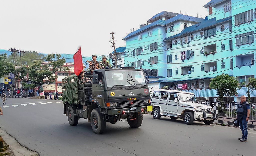 Shillong: Army personnel patrol a street during curfew after clashes between the residents of the city's Punjabi Line area and Khasi drivers of state-run buses, in Shillong on Monday, June 04, 2018. (PTI Photo) (PTI6_4_2018_000172B)