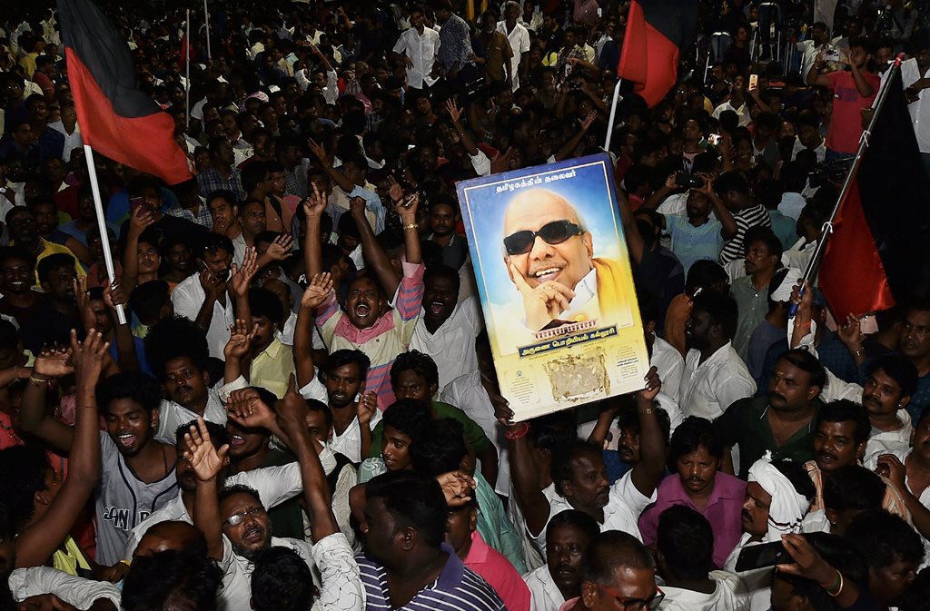 Chennai: Dravida Munnetra Kazhagam (DMK) supporters gather outside the hospital where DMK chief M Karunanidhi is being treated, in Chennai, on Sunday, July 29, 2018. (PTI Photo/R Senthil Kumar) (PTI7_30_2018_000068B)