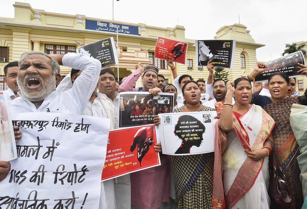 Patna: Rashtriya Janata Dal, Congress and Communist Party of India legislators stage a protest against the Bihar shelter home case during the ongoing Monsoon Session, outside Bihar Assembly in Patna on Tuesday, July 24, 2018. (PTI Photo)(PTI7_24_2018_000026B)
