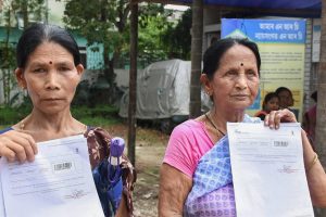 Guwahati: Maya Devi Sonar (left) and Malati Thapa, residents of Hatigaon, show documents outside the National Register of Citizens (NRC) Seva Kendra claiming that their and their family members’ names were not included in the final draft of the state's NRC, in Guwahati on Monday, July 30, 2018. (PTI Photo) (PTI7_30_2018_000117B)