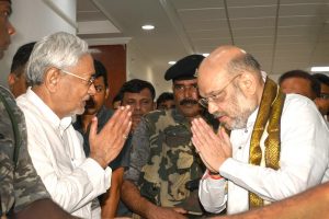 Patna: Bihar Chief Minister Nitish Kumar and Bharatiya Janata Party (BJP) President Amit Shah exchange greetings before a breakfast meeting at the state guest house, in Patna on Thursday, July 12, 2018. (PTI Photo) (PTI7_12_2018_000060B)