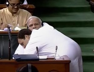 New Delhi: Congress President Rahul Gandhi hugs Prime Minister Narendra Modi after his speech in the Lok Sabha on 'no-confidence motion' during the Monsoon Session of Parliament, in New Delhi on Friday, July 20, 2018. (LSTV GRAB via PTI)(PTI7_20_2018_000088B)
