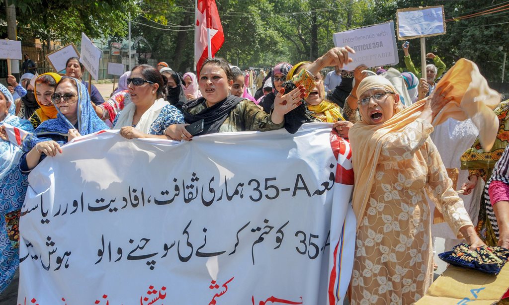 Srinagar: National Conference Women MLAs, MLCs, and other senior leaders raise slogans during a protest march against the petitions filed in the Supreme court challenging the validity of Article 35 A, in Srinagar on Saturday, Aug 4, 2018. Article 35 A, which was incorporated in the Constitution by a 1954 presidential order, accords special rights and privileges to the citizens of J&K. (PTI Photo) (PTI8_4_2018_000066B)