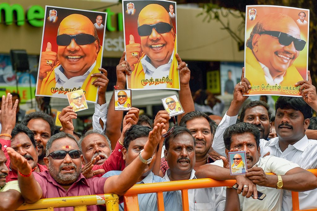 Chennai: DMK supporters gather near the Kauvery Hospital where DMK President M Karunanidhi in undergoing treatment, in Chennai on Tuesday, Aug 7, 2018. Supporters have started thronging the hospital after Karunanidhi's conditions, reportedly, deteriorated on Monday. (PTI Photo) (PTI8_7_2018_000151B)