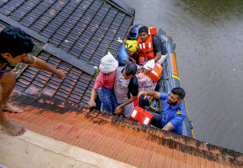 Kottayam : Rescue teams evacuate people from flood affected areas, to relief camps at Kottayam district in Kerala, on Monday, Aug. 20, 2018. (PTI Photo/Coast Guard)(PTI8_20_2018_000096B)