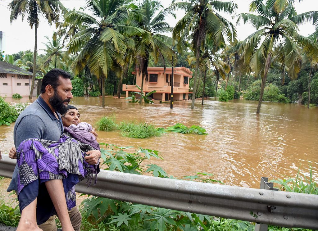 Kochi: People being rescued from a flood-affected region following heavy monsoon rainfall, in Kochi on Thursday, Aug 16, 2018. (PTI Photo) (PTI8_16_2018_000195B)