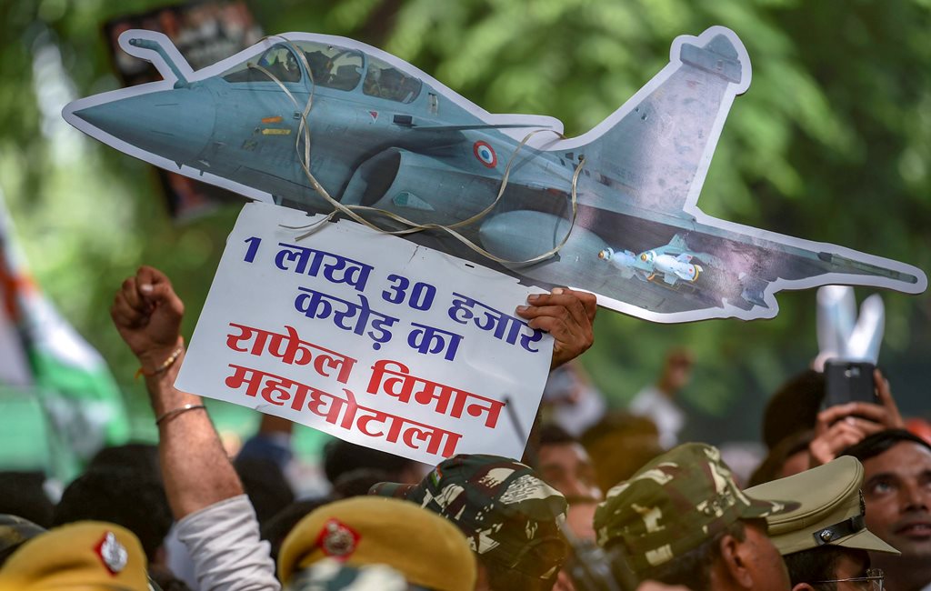 New Delhi: Indian Youth Congress (IYC) members display a cut-out during a protest against Rafale deal scam, at Akbar Road in New Delhi on Thursday, Aug 30, 2018. (PTI Photo/Atul Yadav) (PTI8_30_2018_000121B)