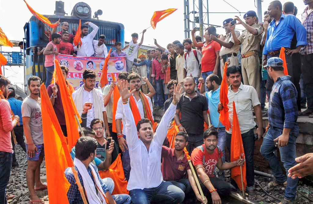 Patna: Swarn Sena activists stop a train during their Bharat bandh, called to press for reservation, in Patna, Thursday, Sept 6, 2018. (PTI Photo) (PTI9_6_2018_000075B)
