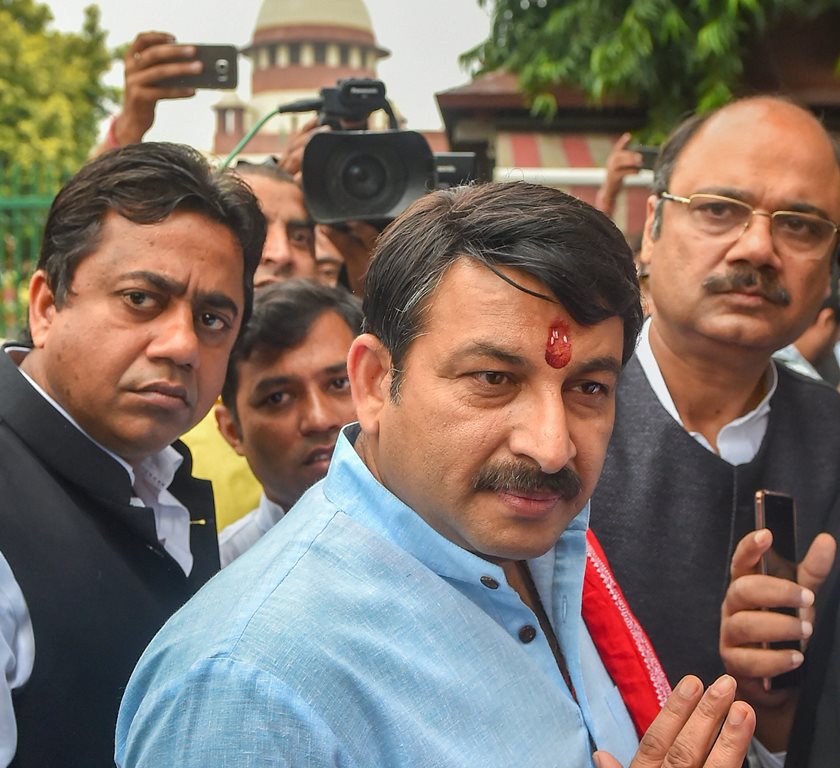 New Delhi: Delhi BJP President Manoj Tiwari addresses the media, outside the Supreme Court premises, in New Delhi, Tuesday, Sept 25, 2018. The Supreme Court took strong exception to Tiwari for allegedly violating its directions on the sealing of illegal structures in the national capital, and said that being an MP does not give him liberty to take the law in his hands. (PTI Photo/Kamal Kishore) (Story No. LGD28) (PTI9_25_2018_000060B)