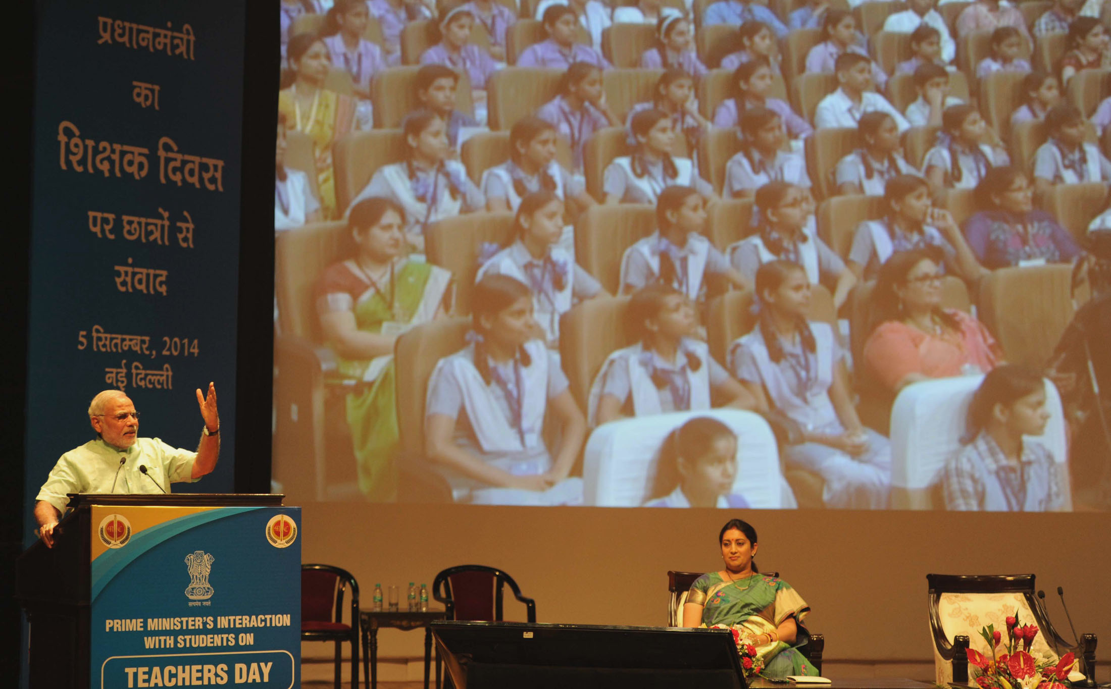 The Prime Minister, Shri Narendra Modi addressing at the "Teachers' Day" function, at Manekshaw Auditorium, in New Delhi on September 05, 2014. The Union Minister for Human Resource Development, Smt. Smriti Irani is also seen.