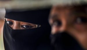 New Delhi: A Muslim woman looks on, near Jama Masjid in New Delhi, Wednesday, Sept 19, 2018. The Union Cabinet approved an ordinance to ban the practice of instant triple talaq. Under the proposed ordinance, giving instant triple talaq will be illegal and void and will attract a jail term of three years for the husband. (PTI Photo/Atul Yadav) (Story No. TAR20) (PTI9_19_2018_000096B)