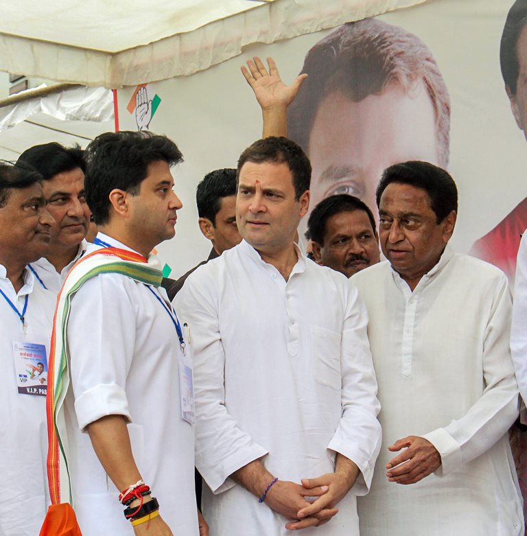 Bhopal: Congress President Rahul Gandhi (C), Congress leader and MP Jyotiraditya Madhavrao Scindia (L) and State President Kamal Nath during a roadshow, in Bhopal, Monday, Sept 17, 2018. (PTI Photo)(PTI9_17_2018_000088B)