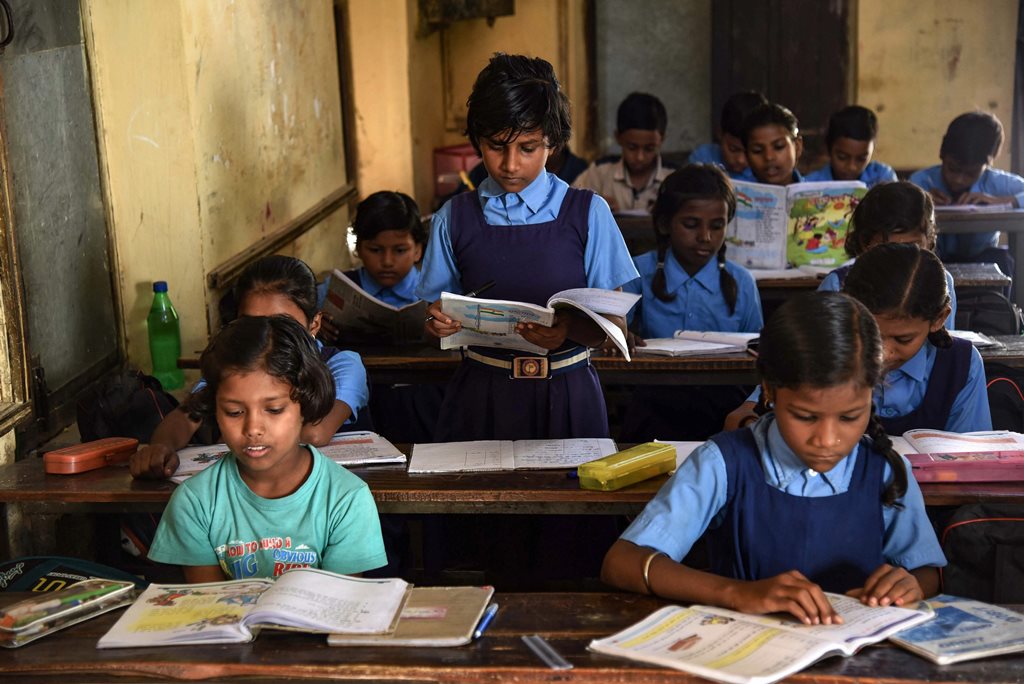 Allahabad: Children attend a class at a Government school on the occasion of 'World Literacy Day', in Allahabad, Saturday, Sept 8, 2018. (PTI Photo) (PTI9_8_2018_000090B)