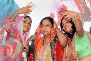 Barmer: Women take selfie with Rajasthan Chief Minister Vasundhara Raje during 'Rajasthan Gaurav Yatra' at Baytu, near Barmer on Sunday, Sept 2, 2018. (PTI Photo) (PTI9_2_2018_000122B)