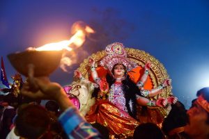 Allahabad: Hindu devotees carry an idol of Goddess Durga for immersion in a pond near Ganges River, at the end of Navratri festival in Allahabad, Friday, October 19, 2018. (PTI Photo) (PTI10_19_2018_000139B)