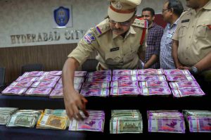 Hyderabad: Hyderabad Police Commissioner Anjani Kumar inspects currency worth Rs 99.36 lakh seized from an alleged hawala transaction, in Hyderabad, Friday, Oct 5, 2018. (PTI Photo) (PTI10_5_2018_000168B)