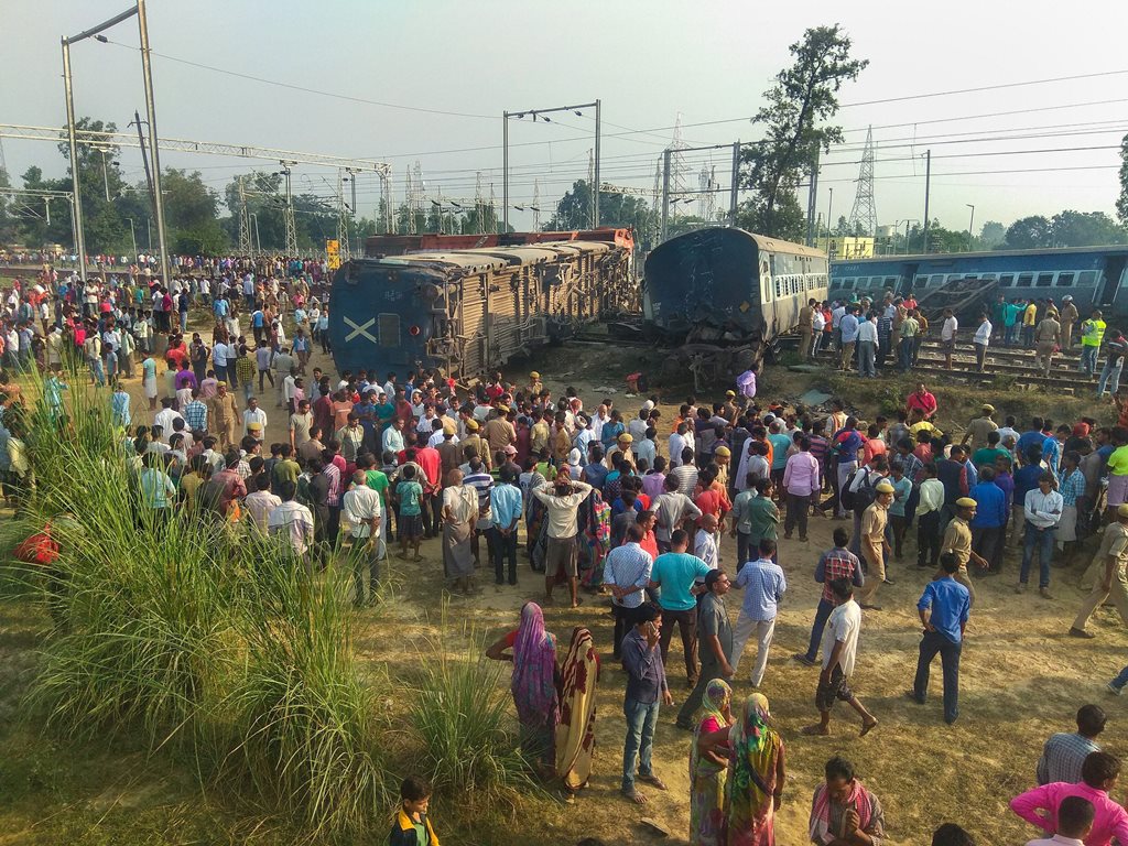 Raebareli: Police at locals at the site of the accident where eight coaches and the engine of the New Farakka Express train derailed near Raebareli, Wednesday, Oct 10, 2018. At least four people were killed in the accident. (PTI Photo) (PTI10_10_2018_000025B)