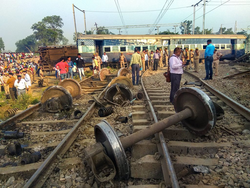 Raebareli: Police at locals at the site of the accident where eight coaches and the engine of the New Farakka Express train derailed near Raebareli, Wednesday, Oct 10, 2018. At least four people were killed in the accident. (PTI Photo) (PTI10_10_2018_000024B)