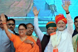 Ajmer: Prime Minister Narendra Modi and Rajasthan Chief Minister Vasundhara Raje greet their supporters during 'Vijay Sankalp Sabha', in Ajmer, Saturday, Oct 6, 2018. (PTI Photo) (PTI10_6_2018_000122B)