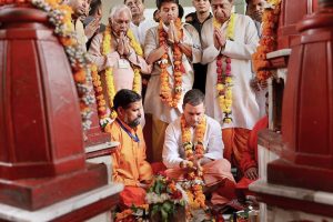 Datia: Congress President Rahul Gandhi offers prayers at Pitambara Peeth in Datia, Monday, Oct 15, 2018. MP Congress chief Kamal Nath and party leader Jyotiraditya Scindia are also seen. (PTI Photo) (PTI10_15_2018_000042B)