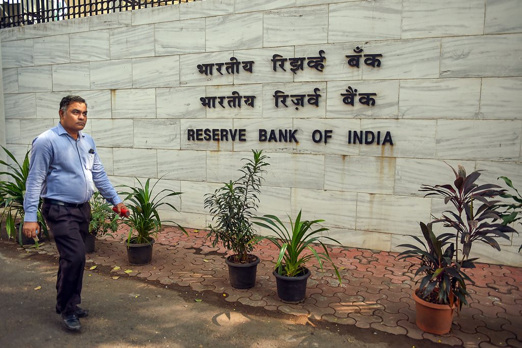 Mumbai: A man walks past near the Reserve Bank of India Headquarters, in Mumbai, Monday, Nov. 19, 2018. RBI board meeting is being held today in Mumbai amid reports of rising tensions between the central bank and the government. (PTI Photo/Shashank Parade) (PTI11_19_2018_000076B)