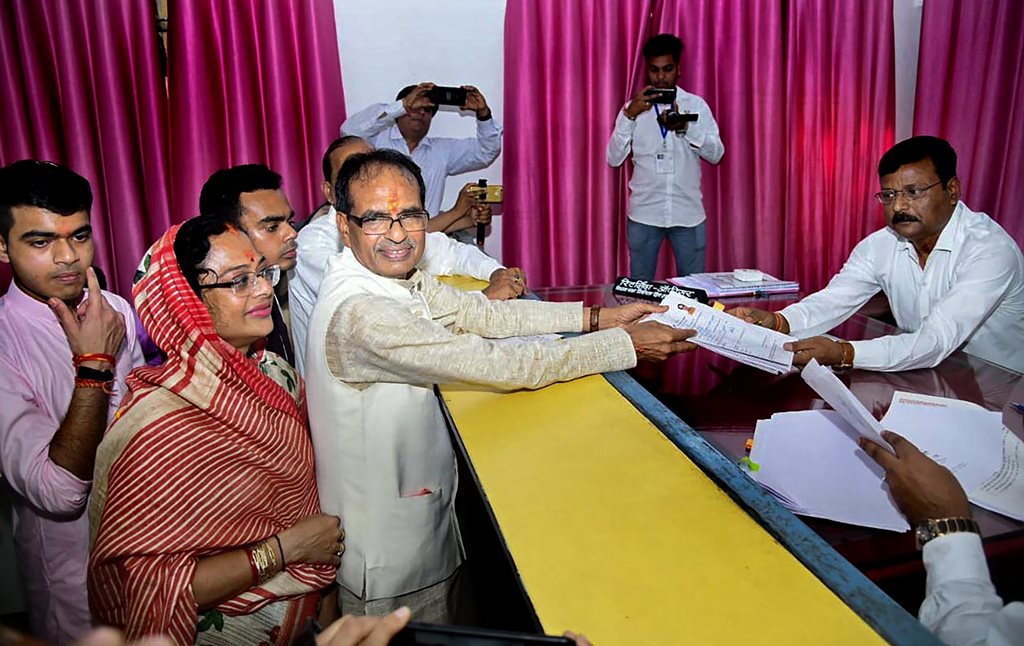 Sehore: Madhya Pradesh Chief Minister and BJP candidate Shivraj Singh Chouhan files his nomination paper in view of upcoming Assembly Elections, from Budhni, Sehore district, Monday, Nov 05, 2018. Shivraj's wife Sadhna and sons Kunal and Kartikey are also seen. (PTI Photo)(PTI11_5_2018_000085B)
