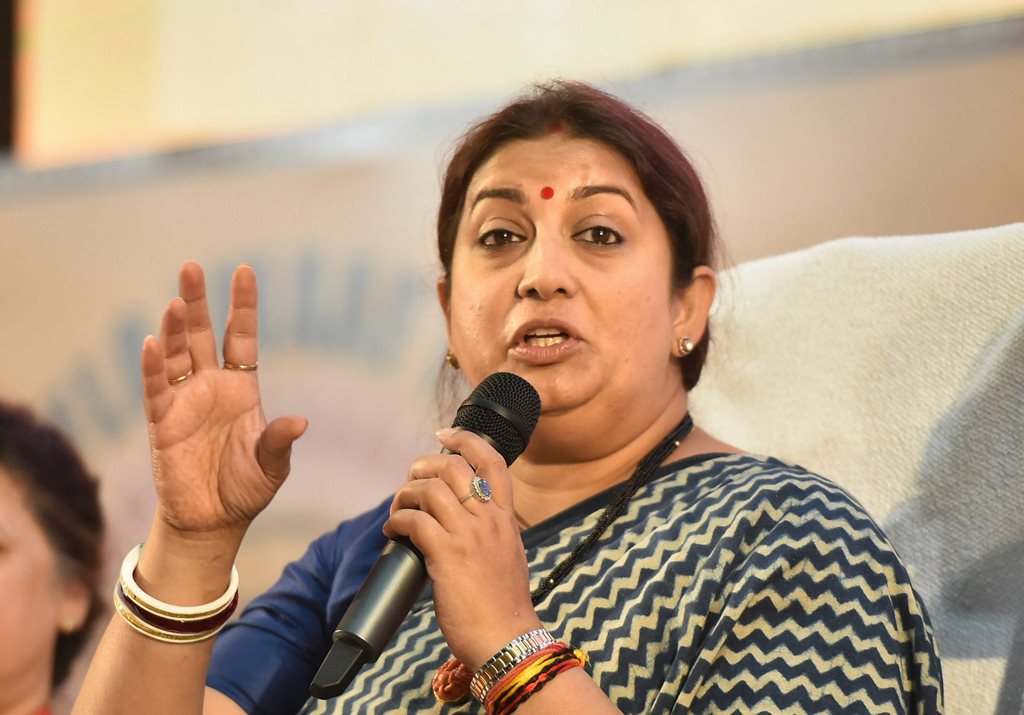 Lucknow: Union Textile Minister Smriti Irani addresses during a panel discussion on 'Creating Global Opportunities and Communication Strategies for Women Entrepreneurs & Artisans', in Lucknow, Nov 16, 2018. (PTI Photo/Nand Kumar) (PTI11_16_2018_000048B)