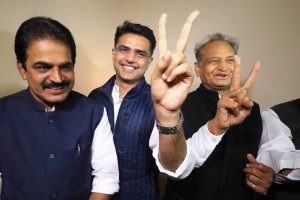 Jaipur: Congress leaders Ashok Gehlot (R) and Sachin Pilot (C) flash victory signs as K.C. Venugopal looks on after the declaration of Rajasthan Assembly election result, in Jaipur, Tuesday, Dec. 11, 2018. (PTI Photo)