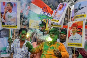 Kolkata: Congress workers celebrate the party's good show in the Assembly elections of Rajasthan, Chhattisgarh and Madhya Pradesh, in Kolkata, Tuesday, Dec. 11, 2018. (PTI Photo) (PTI12_11_2018_000141)