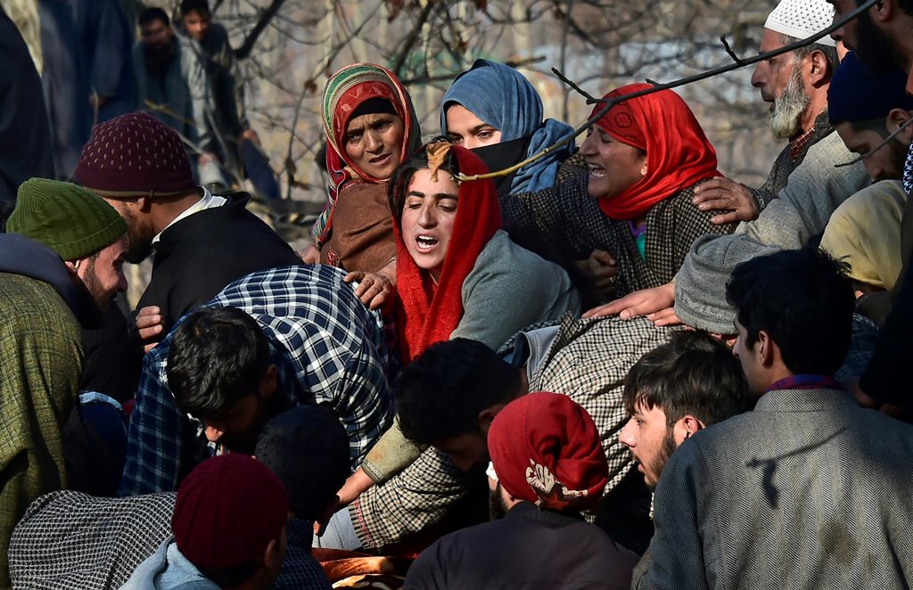 Pulwama: Villagers wail while attending the funeral of civilians and militants who were killed in the encounter between security forces and militants, in Pulwama, south Kashmir, Saturday, Dec 15, 2018. 7 civilians, 3 militants and an army soliders have been killed in the encounter. (PTI Photo/S. Irfan) (PTI12_15_2018_000106B)