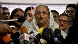 Dhaka : Bangladesh Prime Minister Sheikh Hasina flashes a victory sign as she speaks to the media persons after casting her vote in Dhaka, Bangladesh, Sunday, Dec. 30, 2018. Voting began Sunday in Bangladesh's contentious parliamentary elections, seen as a referendum on what critics call Prime Minister Sheikh Hasina's increasingly authoritarian rule.AP/PTI(AP12_30_2018_000035B)