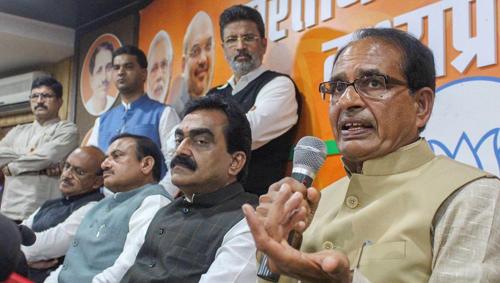Bhopal: Madhya Pradesh Chief Minister Shivraj Singh Chouhan addresses a press conference, at BJP State headquarters in Bhopal, Wednesday, Dec. 12, 2018. BJP State President Rakesh Singh is also seen.(PTI Photo)(PTI12_12_2018_000200)