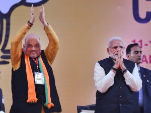 New Delhi: Prime Minister Narendra Modi with BJP National President Amit Shah on the second day of the two-day BJP National Convention, at Ramlila Ground in New Delhi, Saturday, Jan 12, 2019. (PTI Photo/Kamal Kishore) (PTI1_12_2019_000174B)